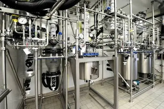 Stainless steel piping systems, pressure gauges and processing equipment in an API manufacturing facility.